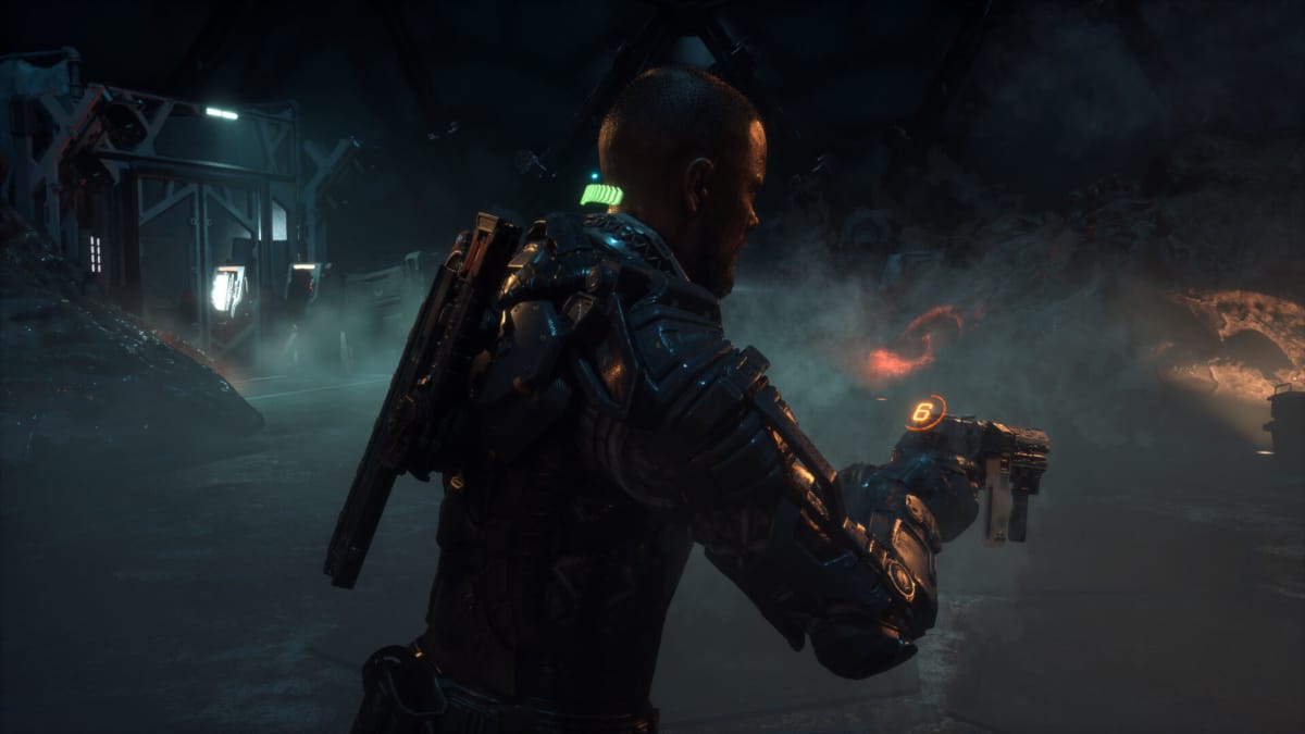 Jacob holding his gun with its diegetic ammo counter in The Callisto Protocol