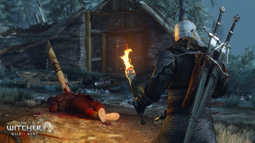 Geralt holds a torch in The Witcher 3