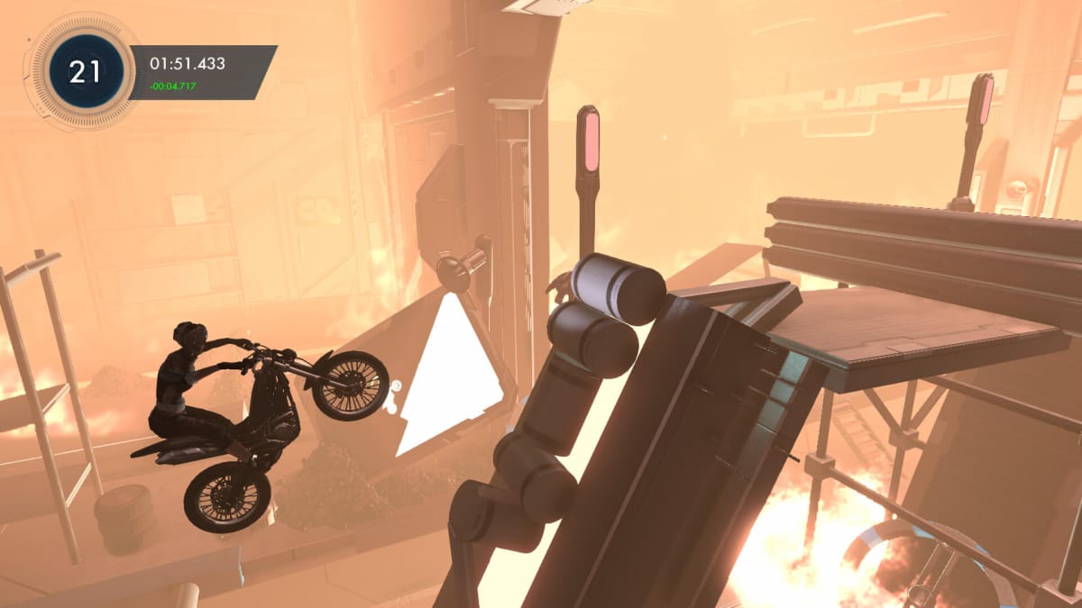 An in-game screenshot of Trials Fusion, showcasing the rider trying to land on a makeshift ramp with a hump in the middle, among a fiery building.