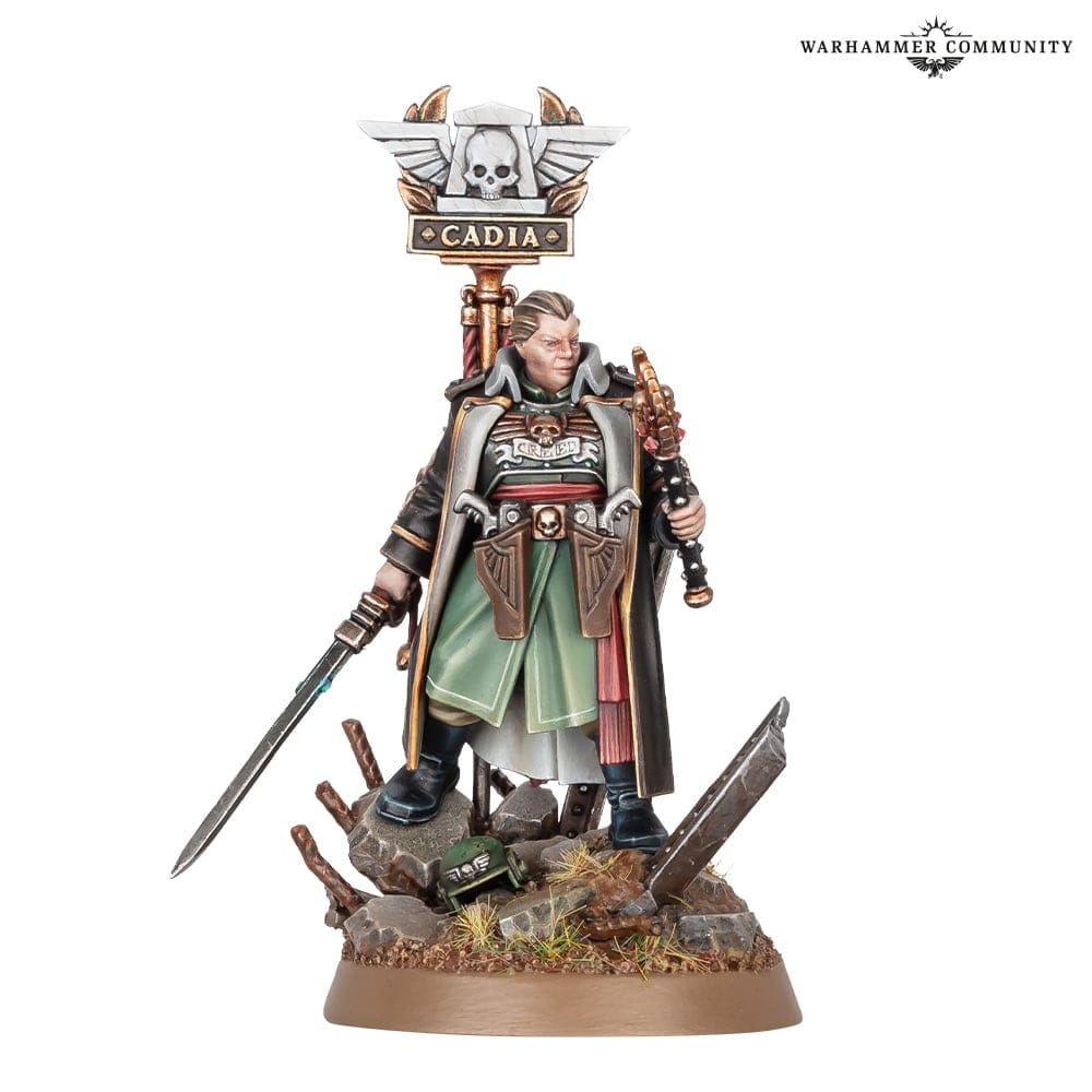A model for the Warhammer 40K Astra Militarum character Ursula Creed, showing her standing atop rubble