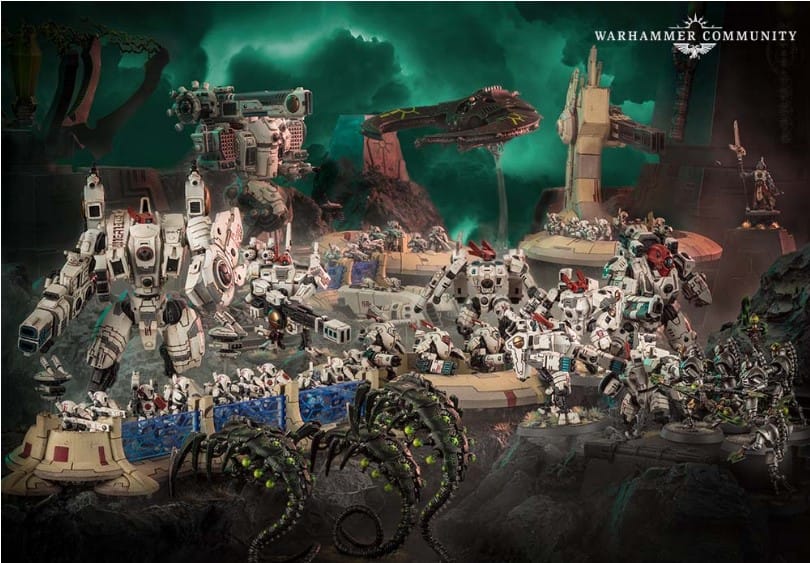 An image of Tau miniatures laid out on terrain