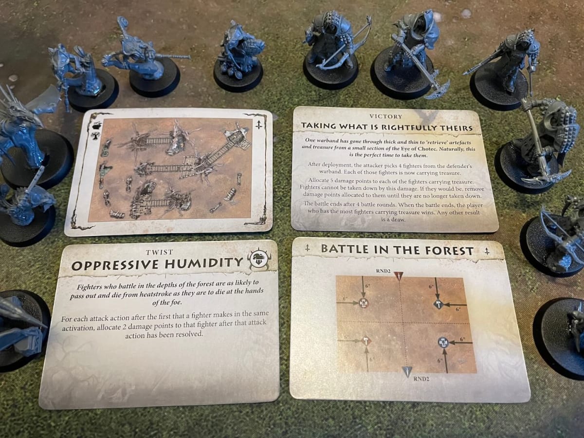 Warhammer Warcry Sundered Fate Battle Cards surrounded by minis