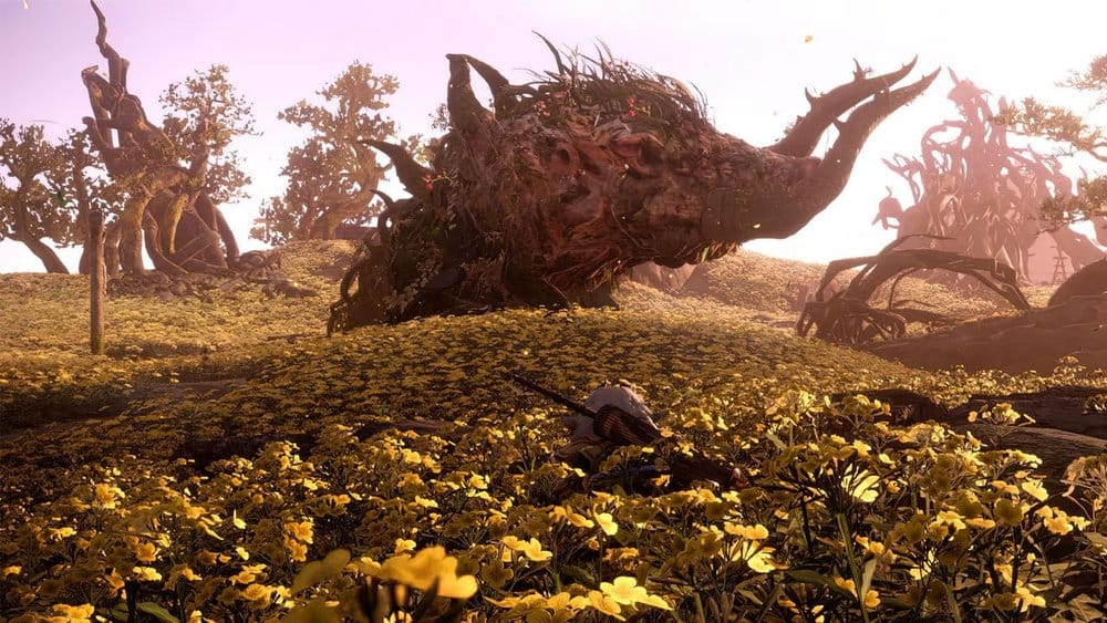 Wild Hearts game header image, Wild Hearts Gameplay Trailer where we see a large boar-like monster standing within a field of lush foliage, with large tusks and moss and twigs growing from its skin