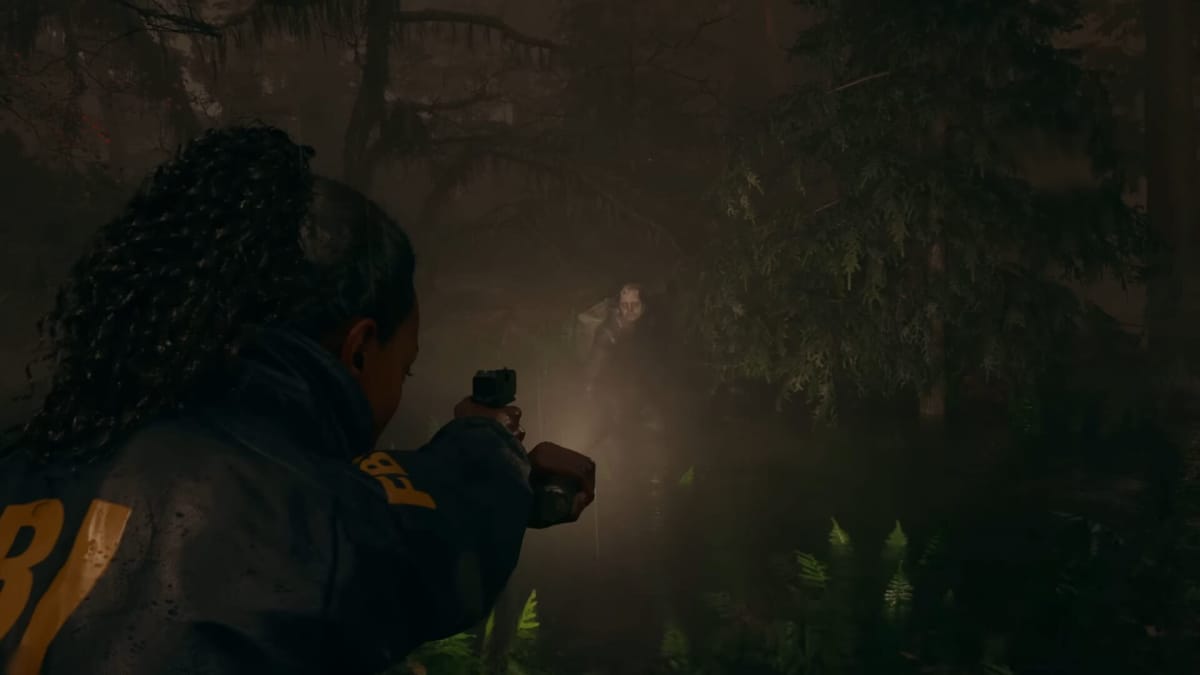 Saga Anderson aiming her weapon with a flashlight attached at an enemy in a forest in Alan Wake 2