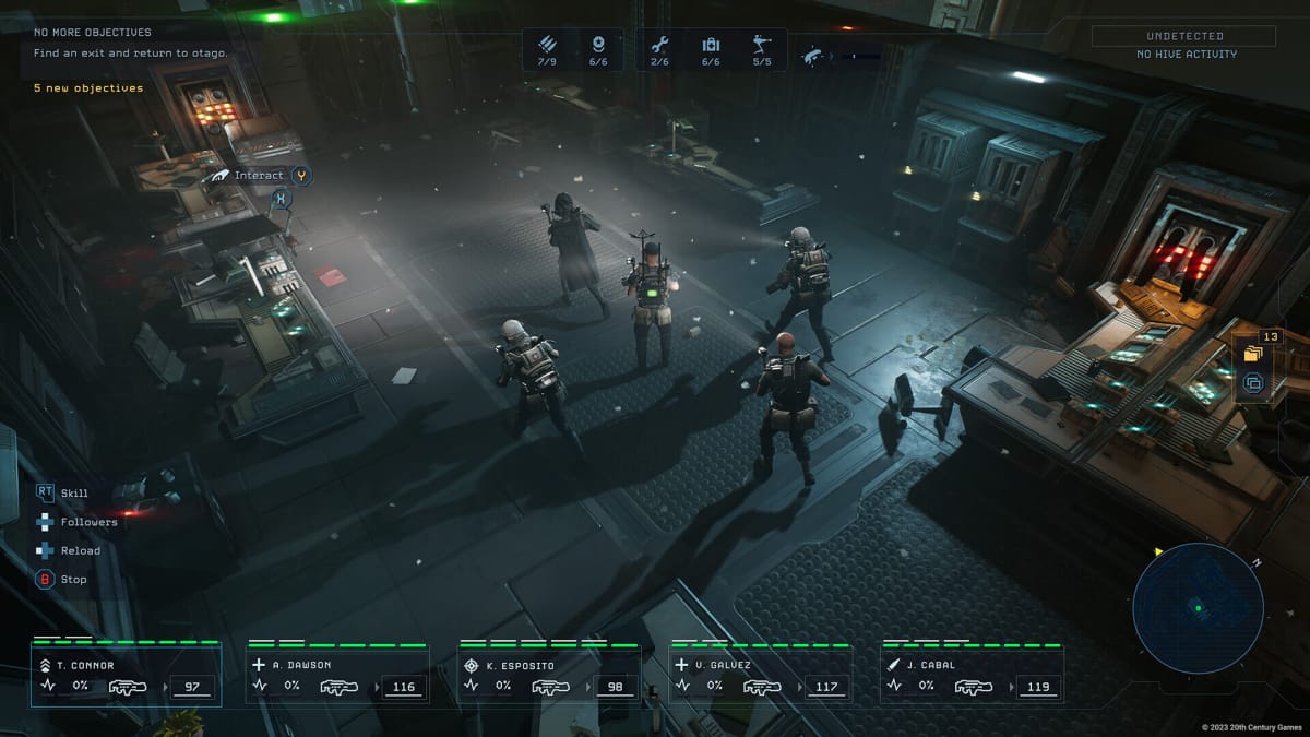 A squad of marines moving through a xeno hive in Aliens: Dark Descent