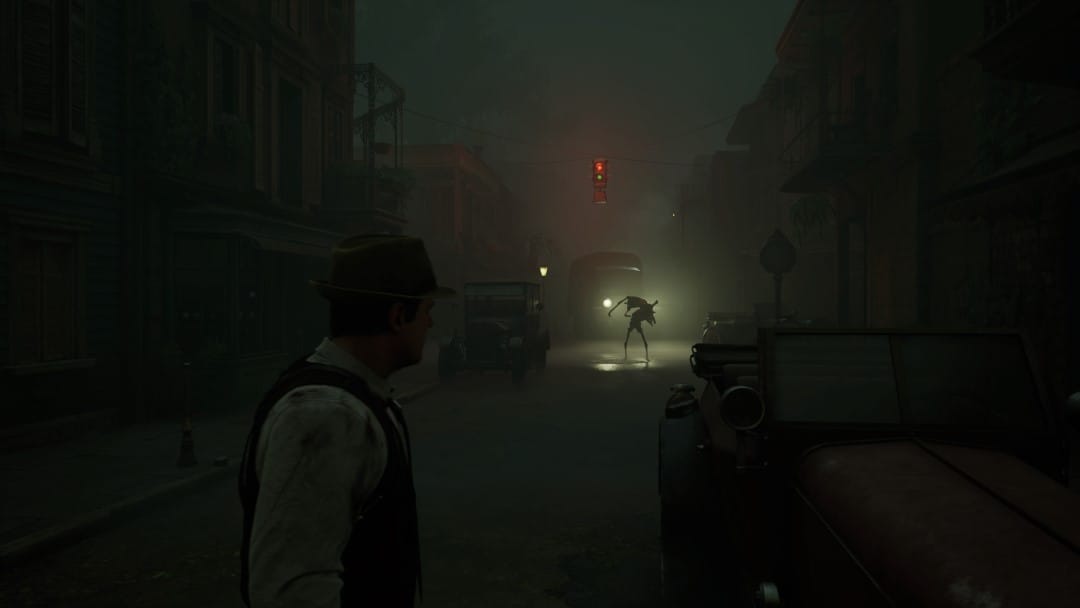 Edward in a dark city street, a monster can be seen in silhouette in the distance