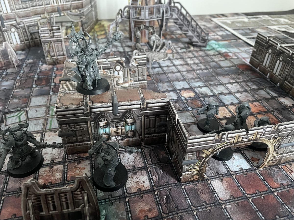 An image from our Battle Systems Gothic Cityscape review featuring miniatures interacting with the space