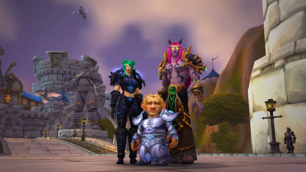 Three Alliance characters standing in Stormwind in the Blizzard game World of Warcraft
