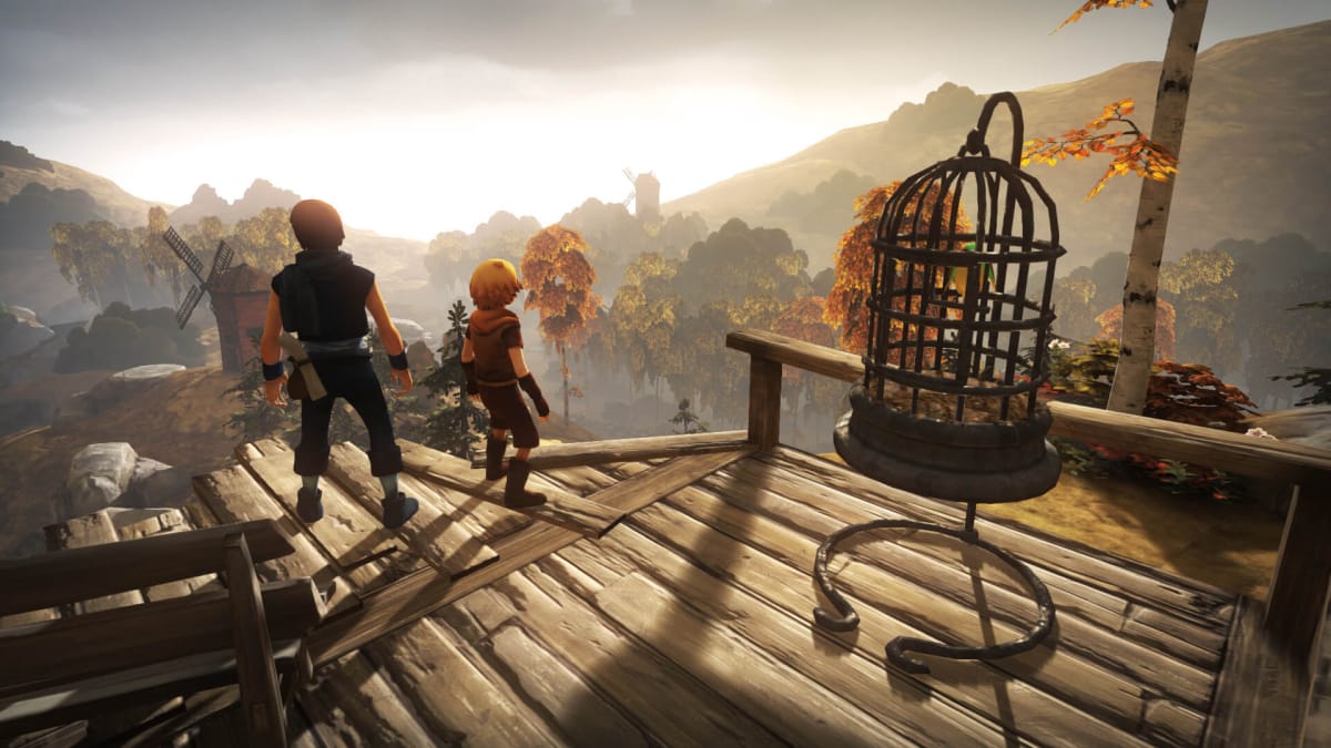 The two brothers looking out over a bucolic landscape from a wooden platform in Brothers: A Tale of Two Sons, part of this PS Plus news story