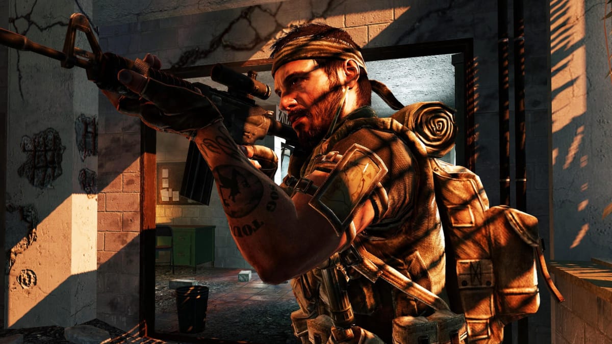 A character with a bandana and a rifle standing in a dilapidated building in Call of Duty: Black Ops, a game on which David Vonderhaar has worked