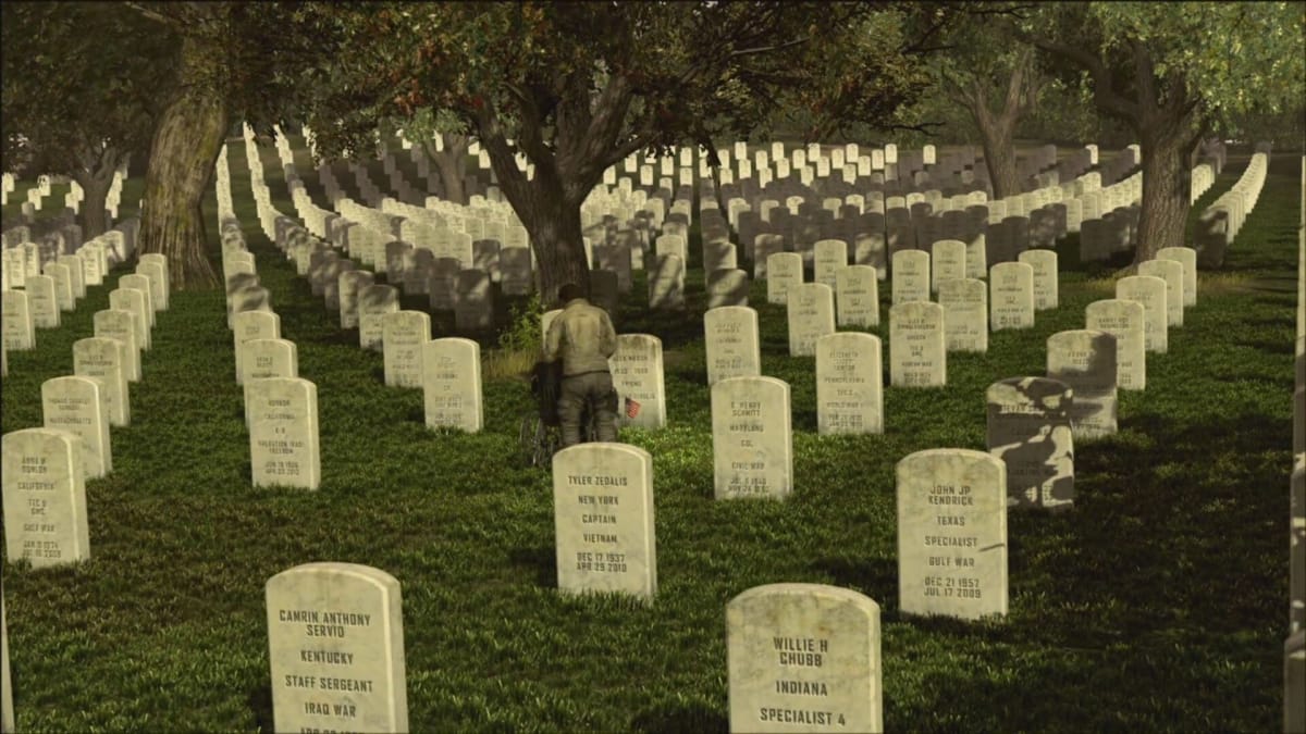 An in-game screenshot of Black Ops 2, showcasing an unknown man standing in the middle of several gravestones of deceased soldiers.