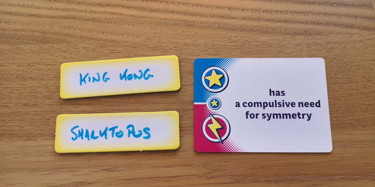Two of the wipe free Champions! name boards and a duel question card.
