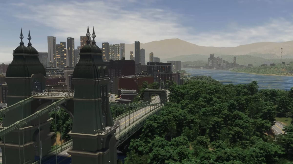 A view of a city with a bridge to the left and a forest to the right in Cities: Skylines 2