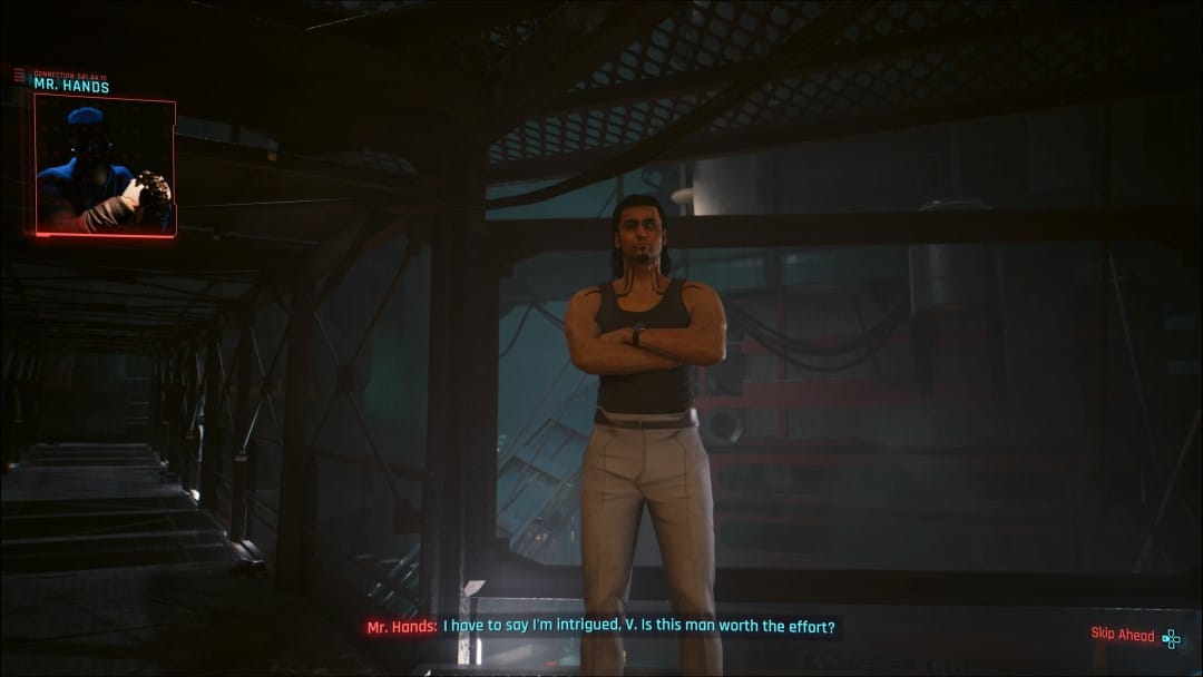 A screenshot of Hasan on an industrial platform, a window in the upper corner shows a video call between V and Mr. Hands negotiating his life from the Cyberpunk 2077 Phantom Liberty Go Your Own Way side story