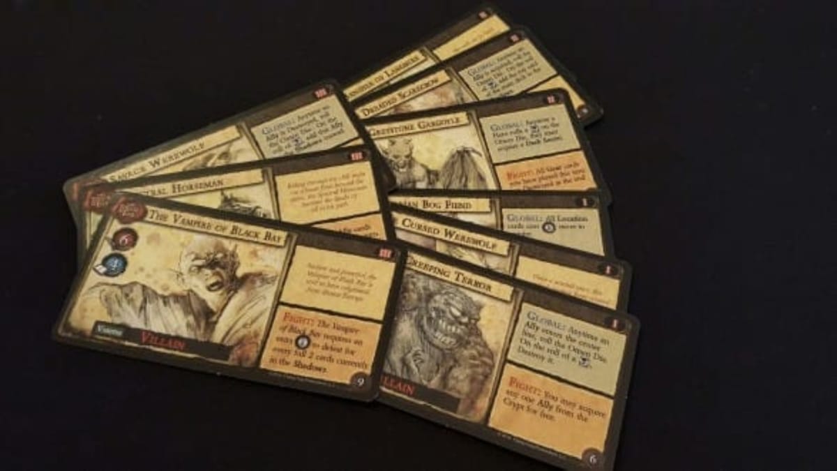 Dark Gothic photo showing several wide cards displaying various monsters that players will have to face during the game