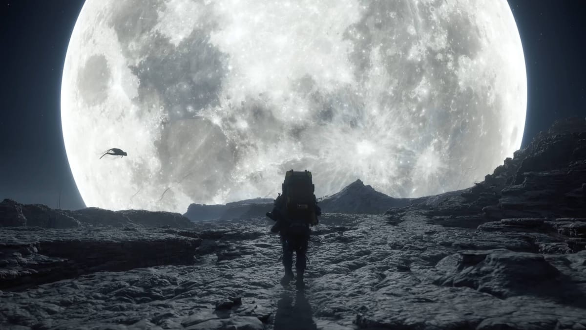 Sam hiking across a landscape with a massive moon and a strange shadow in the background in Death Stranding 2