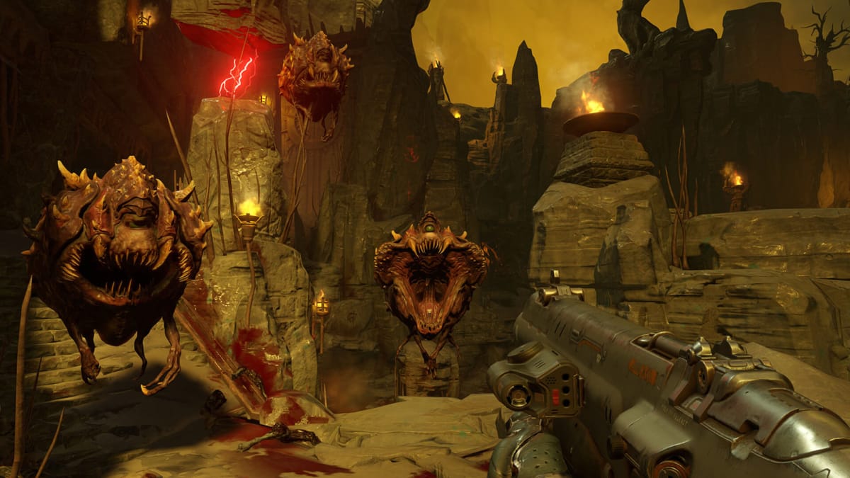 The player wielding a rocket launcher as Cacodemons fly all around them in Doom