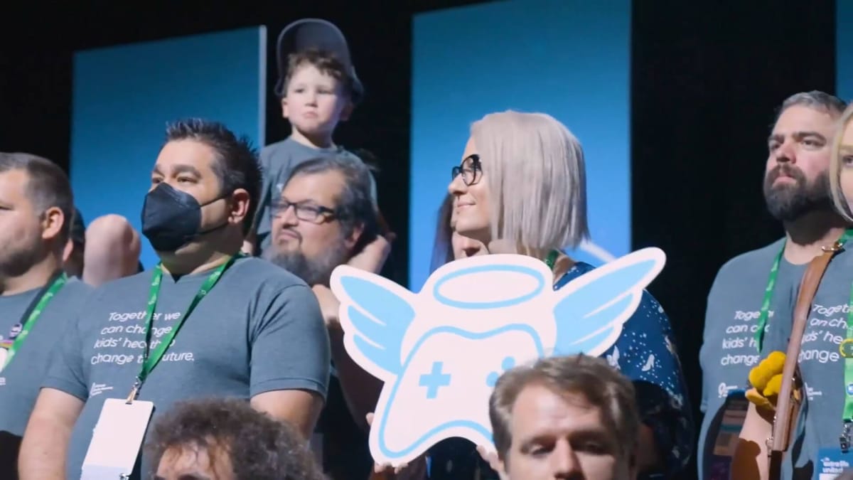 A group of people gathered together to celebrate an Extra Life gaming charity achievement (this image is not from E3 2016, but is intended to illustrate the role of the charity overall)