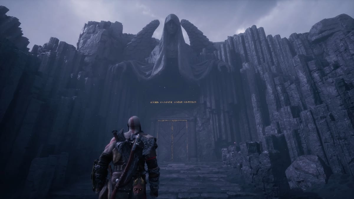 Kratos approaching a large stone door.