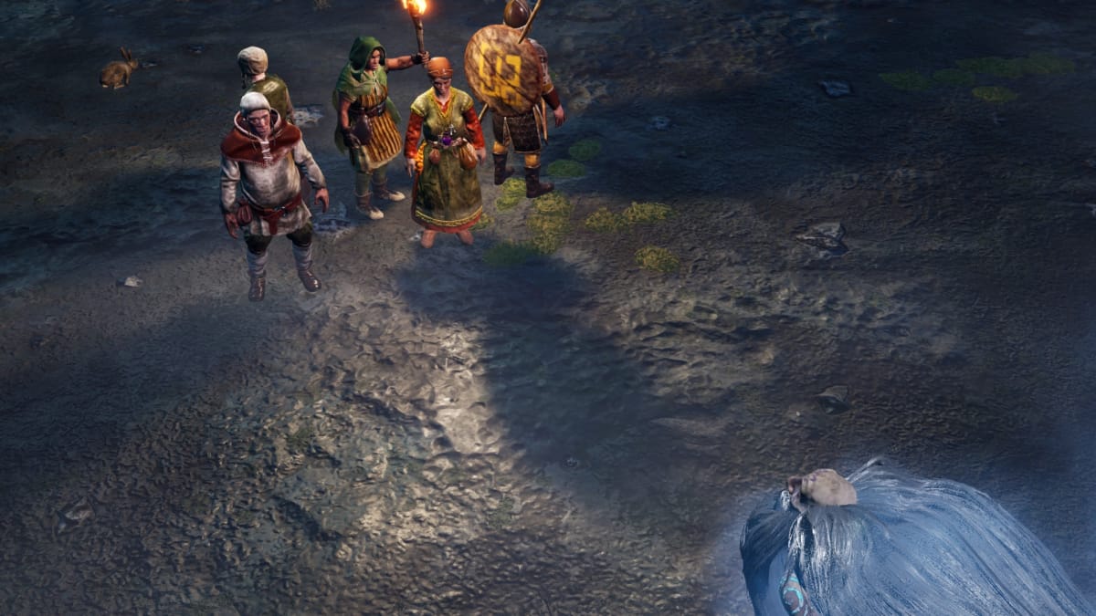 Gord screenshot showing several villagers standing in a huddle with an old man on the right of the screen surrounded by a glowing blue aura