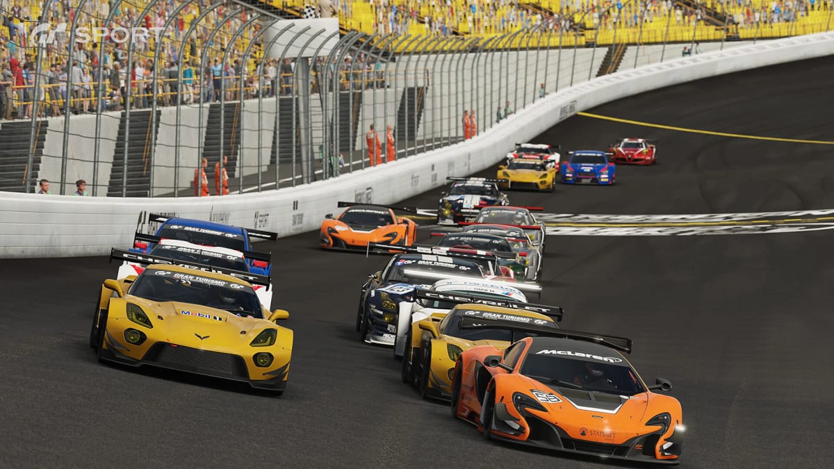 Several cars racing against one another on a track in Gran Turismo Sport