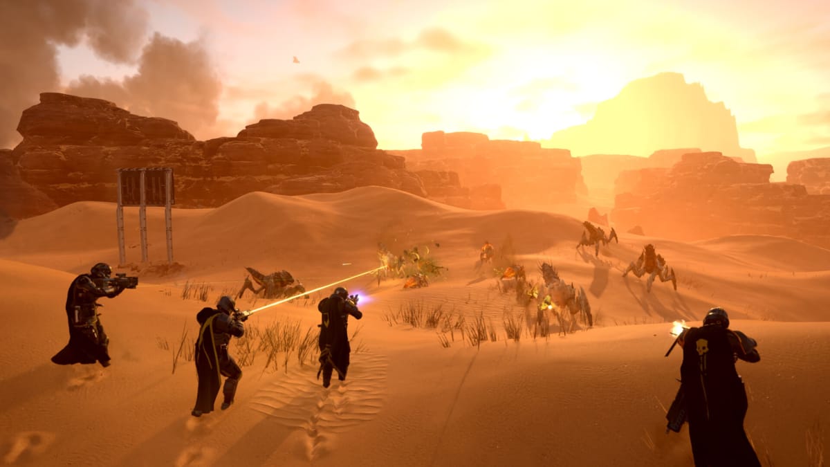 Soldiers battling insects in a desert in Helldivers 2