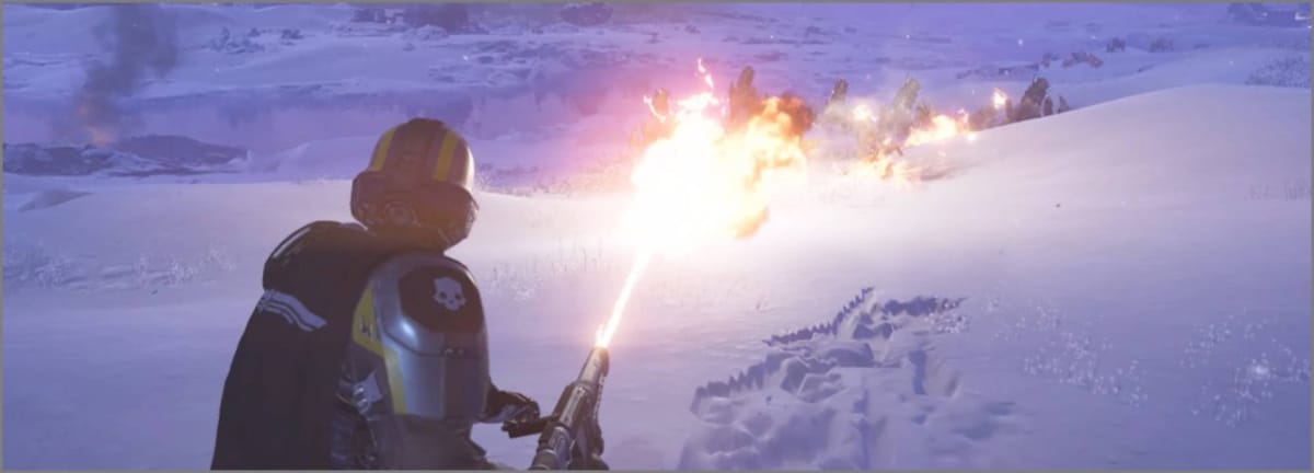 A Helldiver using the Flamethrower to burn Terminid bugs in Helldivers 2