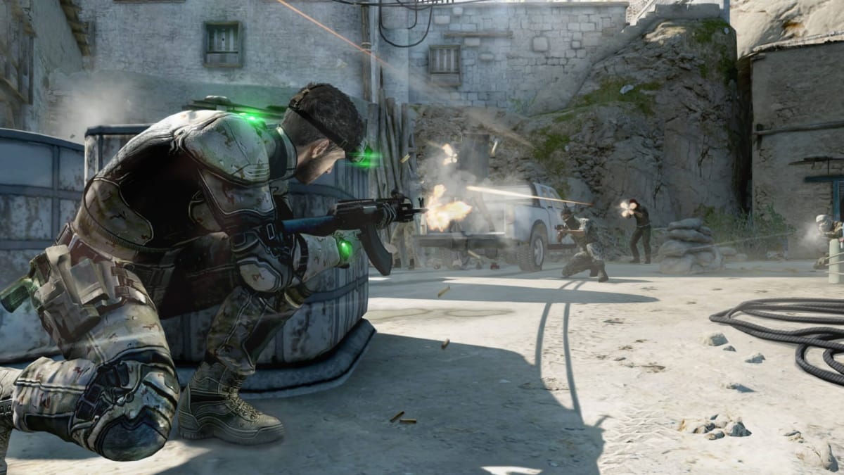 Sam Fisher shooting at enemies in Tom Clancy's Splinter Cell: Blacklist, a game developed by Jade Raymond's Ubisoft Toronto studio