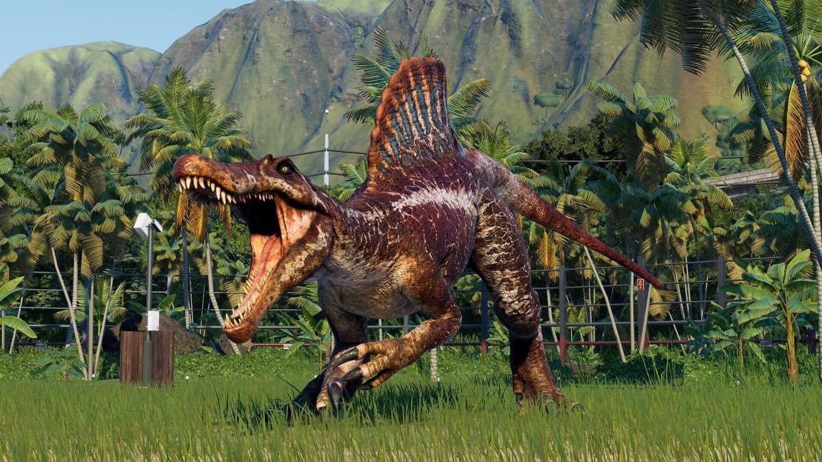 A dinosaur roaring in Jurassic World Evolution 2, developed by Frontier Developments - another studio hit by layoffs alongside Media Molecule