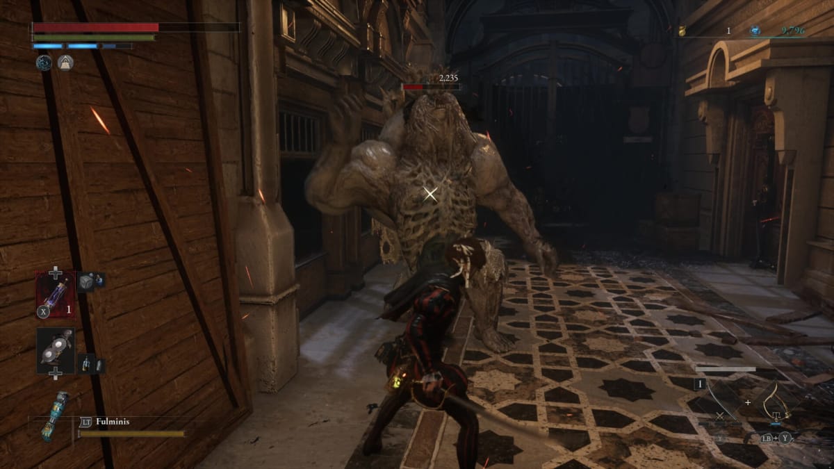 P fighting a large monster enemy inside a shopping arcade in Lies of P