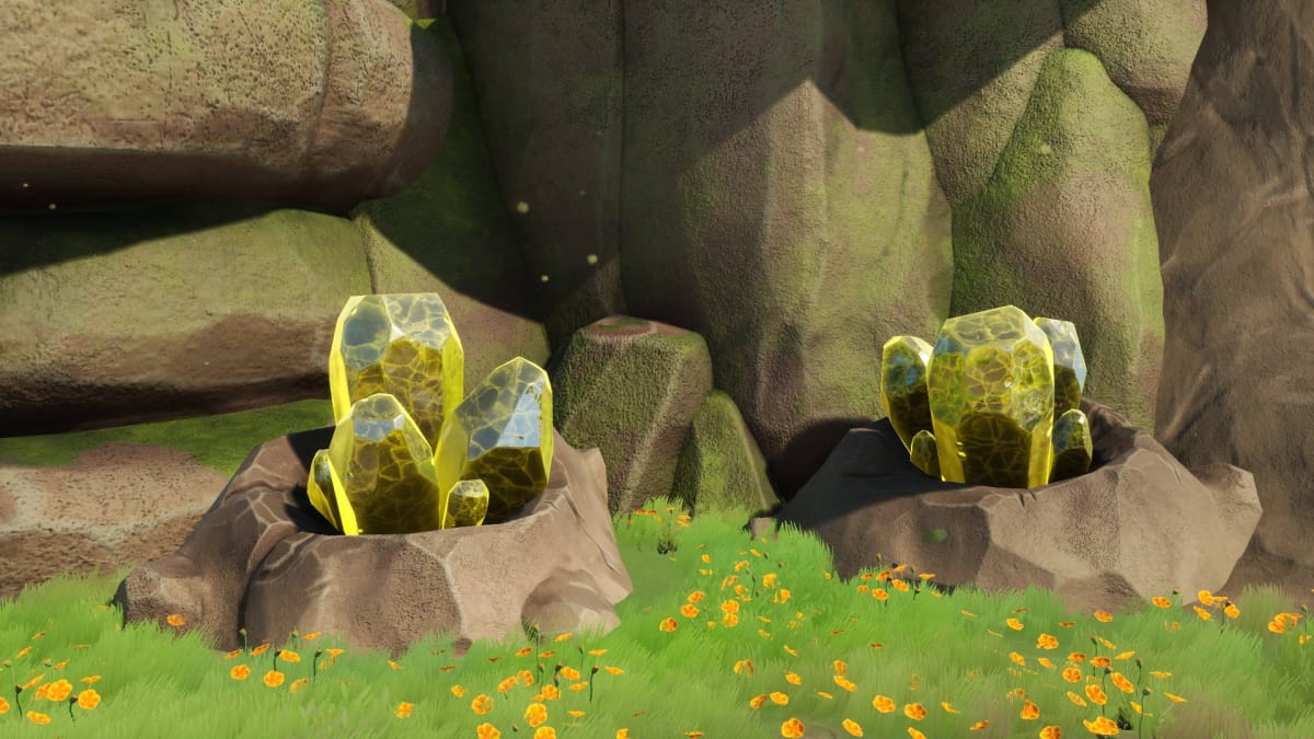 Two Yellow Crystal nodes on grass in front of a cliff