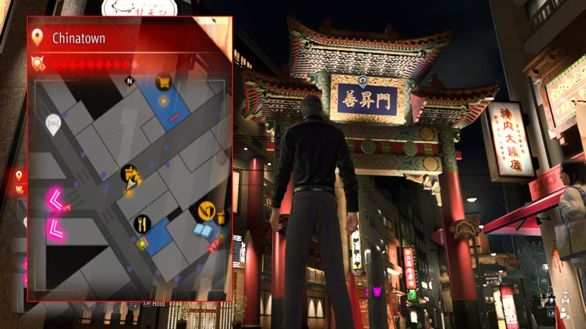 like a dragon infinite wealth screenshot showing a map reference and a huge chinese archway standing over a street
