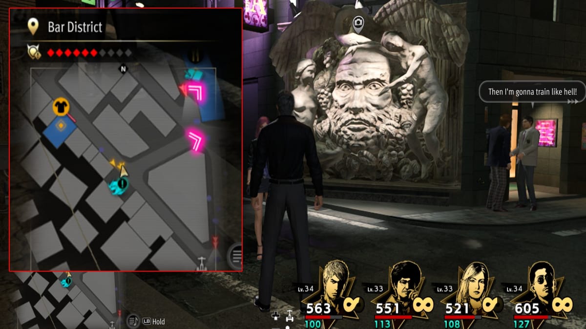like a dragon infinite wealth screenshot showing a map reference and a statue of a big bearded face