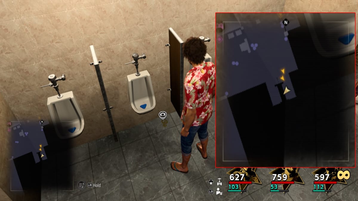 like a dragon screenshot with a map reference and a tiny golden snake symbol on the floor of a public bathroom