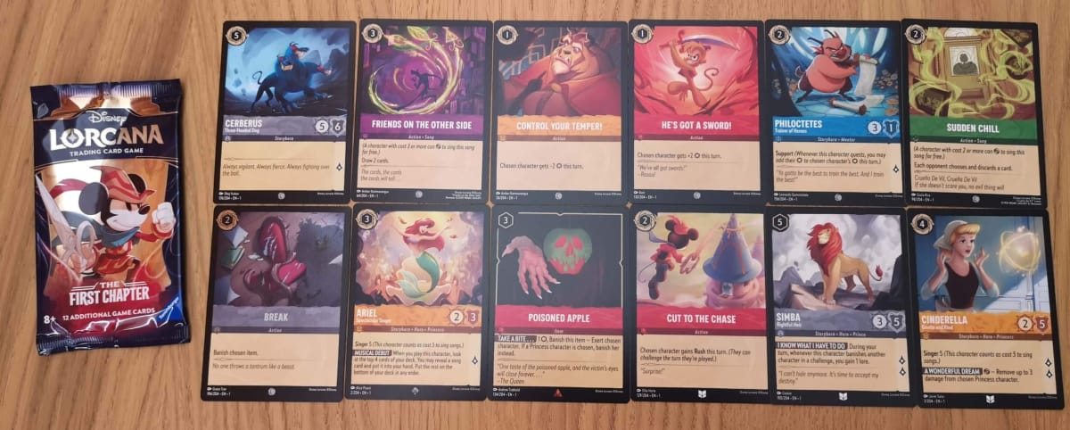 The 12 Disney Lorcana Cards in our First Chapter Booster Pack 10.