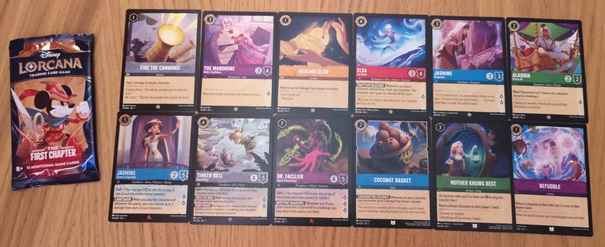 The 12 Disney Lorcana Cards in our First Chapter Booster Pack 14.