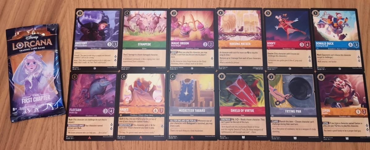The 12 Disney Lorcana Cards in our First Chapter Booster Pack 8.