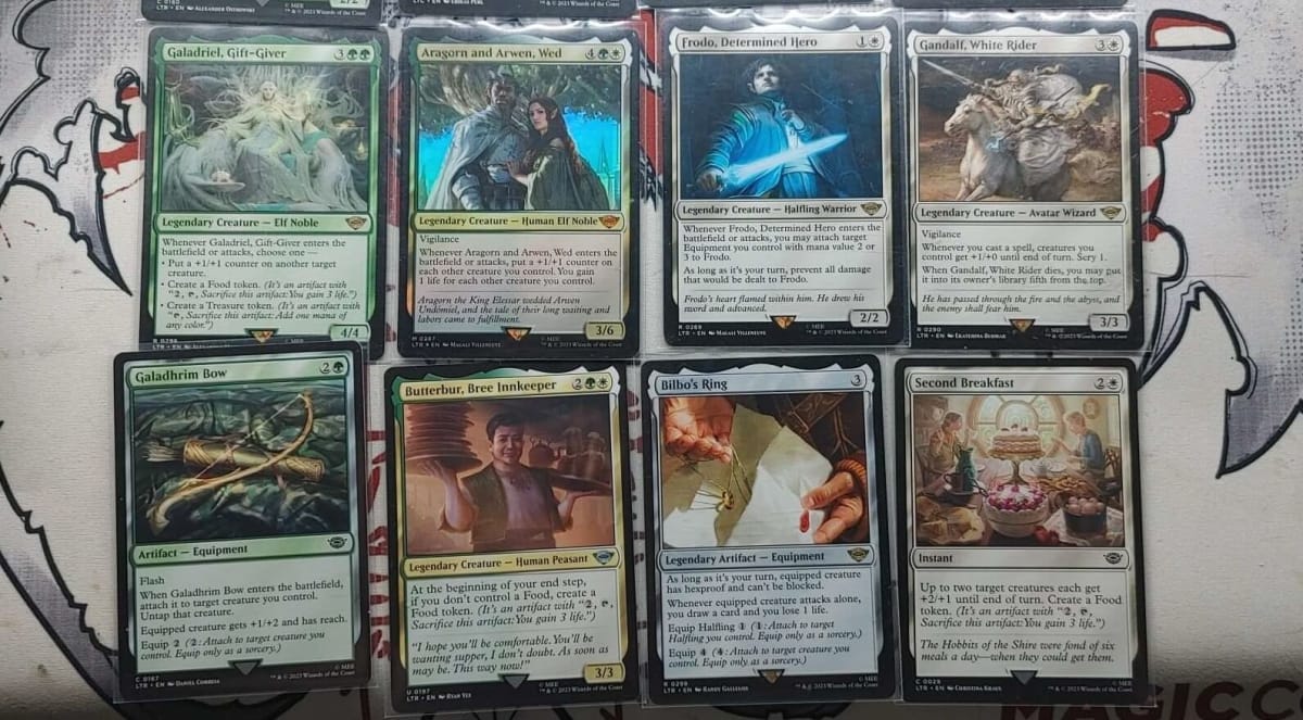 Lord of the Rings: Tales of middle Earth MTG Starter Set Gondor cards (Left to Ring by row): Galadriel, Gift Giver, Aragorn and Arwen, Wed, Frodo, Determined Hero, Gandalf, White Rider, Galadhrim Bow, Butturbur, Bree Innkeeper, Bilbo's Ring, and Second Breakfast