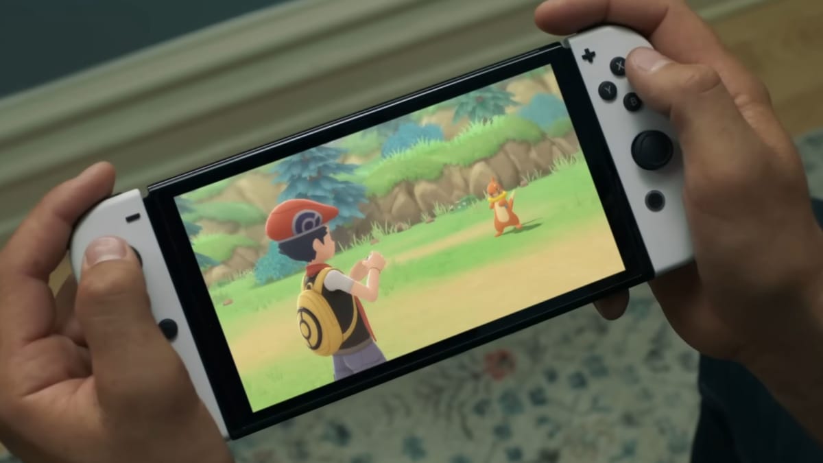 Someone playing a Nintendo Switch on which Pokemon Brilliant Diamond and Shining Pearl are being played