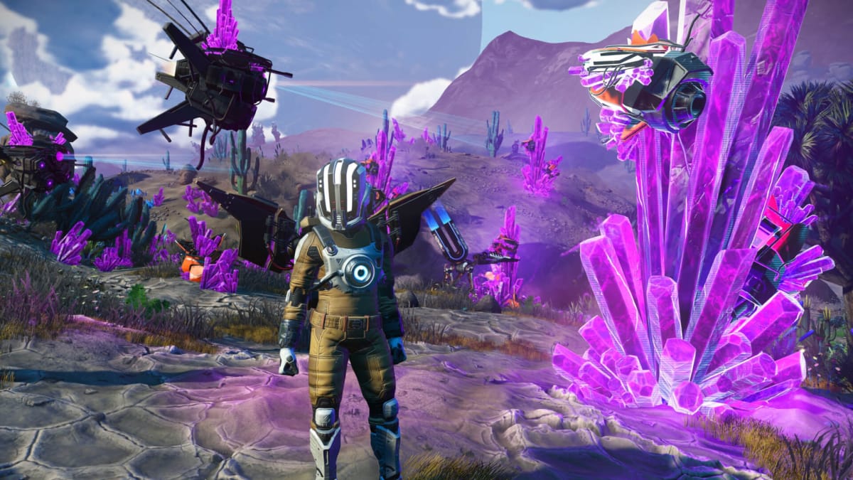 The player standing on an alien planet and surrounded by drones in No Man's Sky
