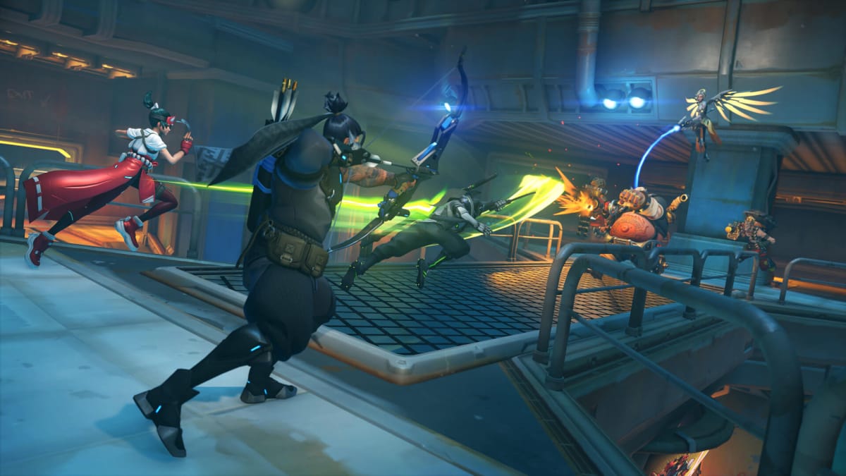 Two teams of heroes battling against one another in a futuristic area in Overwatch 2, an Activision Blizzard game