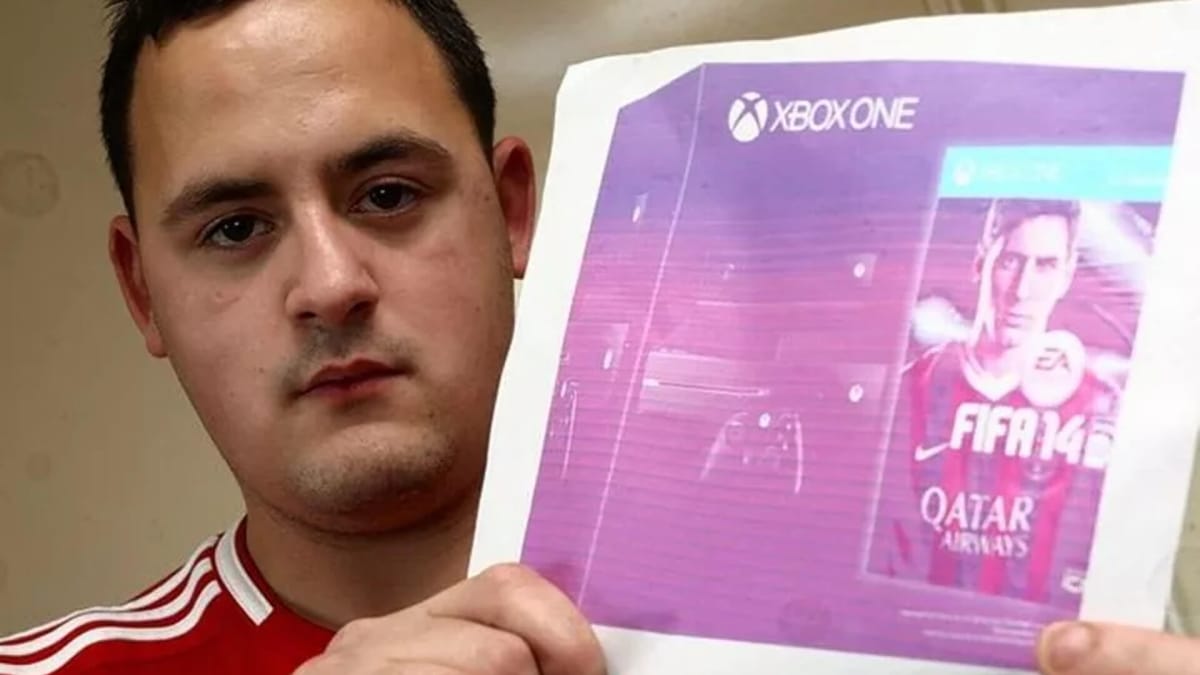 Peter Clatworthy holding up his photo of the Xbox One, courtesy of the Nottingham Post
