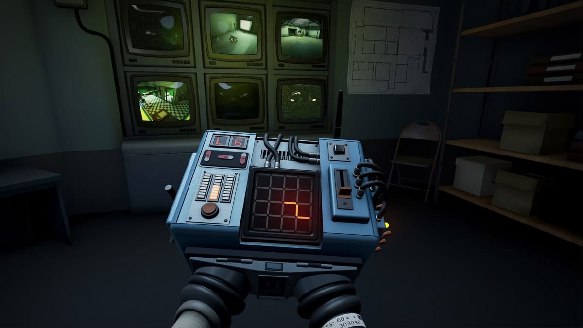 A puzzle box can be seen with an electronic grid and a path. The players hands are attached to the inside of it.