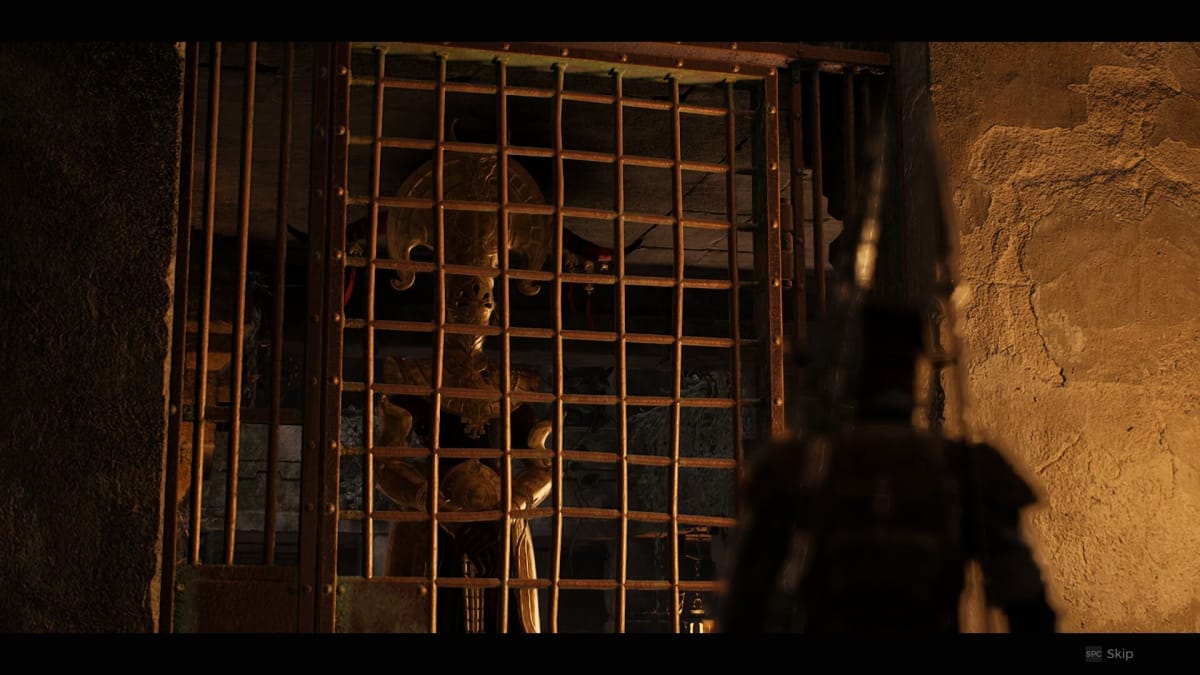 Character looking at the Empress while behind bars in a dimly lit jail cell.