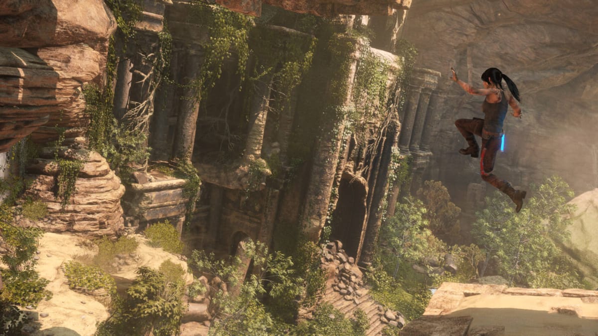 Lara leaping across a chasm in Rise of the Tomb Raider, an Xbox Game Pass December 2023 title