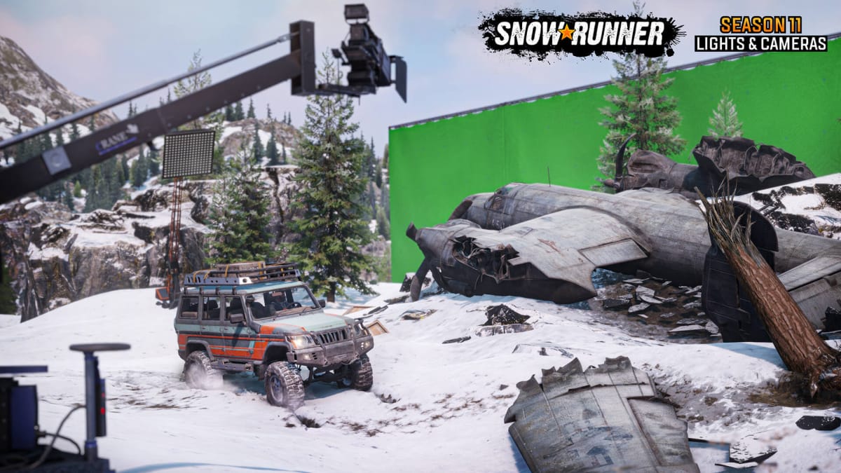 A crashed plane movie prop in front of a green screen in SnowRunner season 11