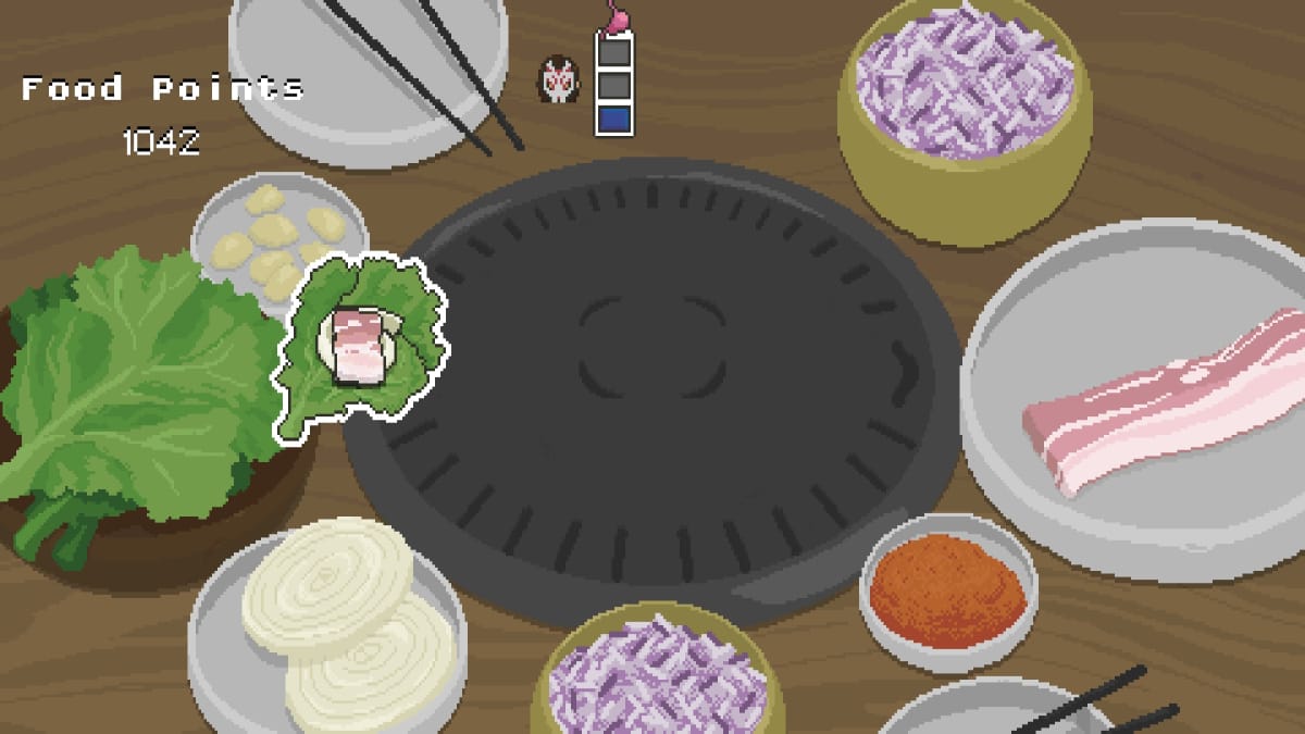 Spirittea screenshot showing an already prepared lettuce leaf filled with various cooked toppings including meat onions and garlic