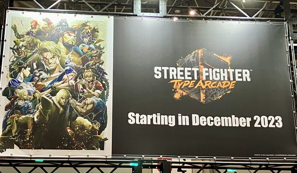 A billboard with the Street Fighter 6 Type Arcade Key art and logo