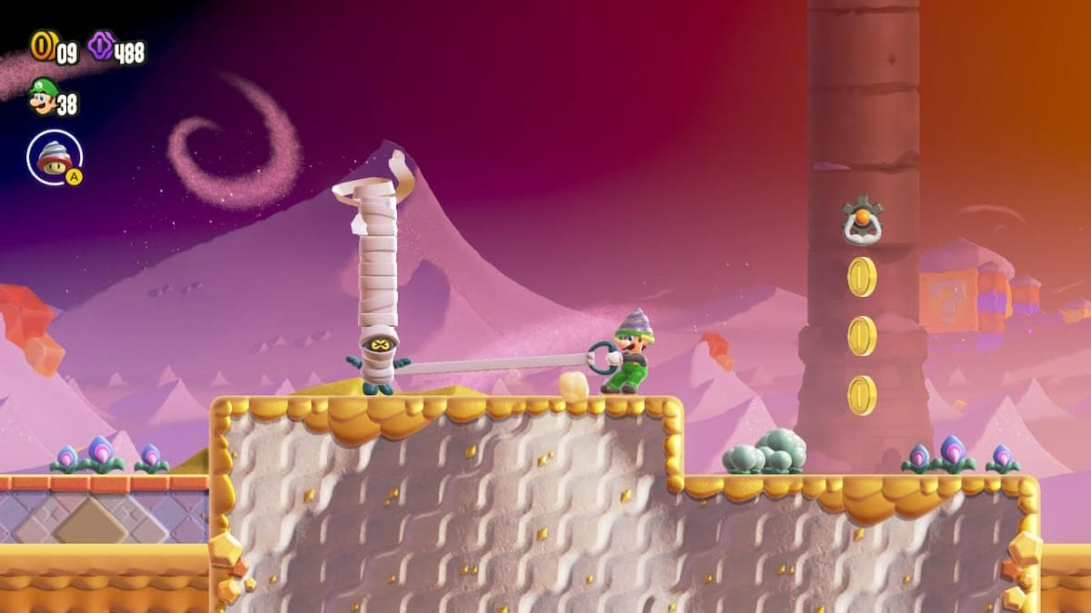 Luigi with his drill upgrade takes on a mummy in Super Mario Wonder.