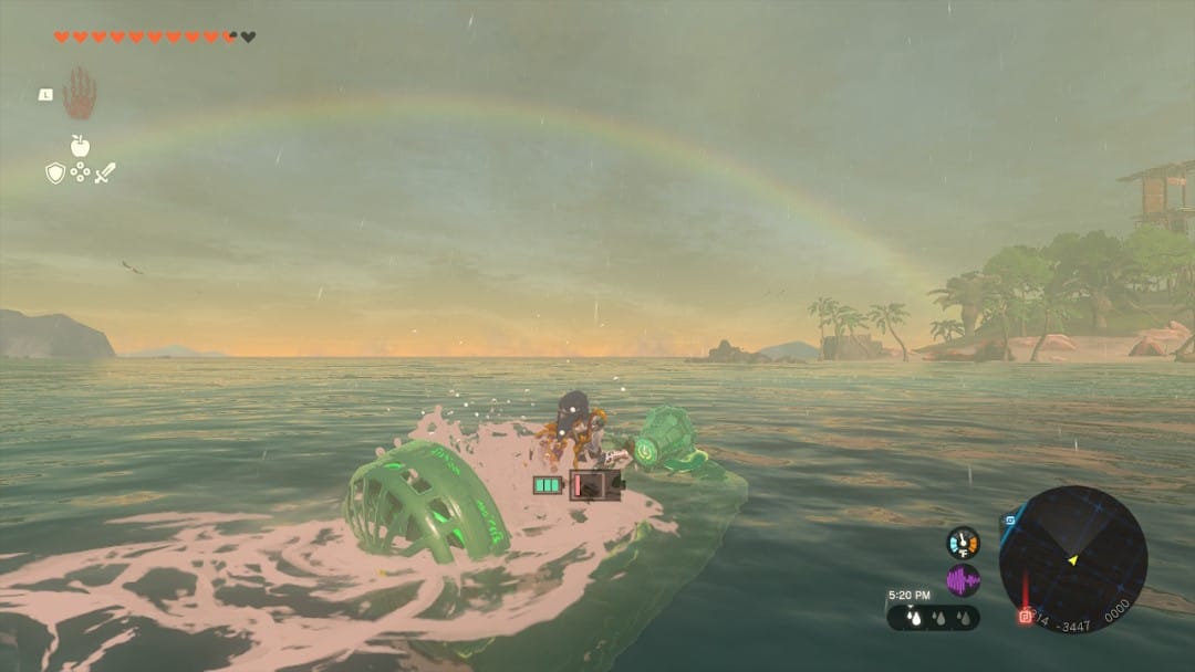 A screenshot from Legend of Zelda: Tears of the Kingdom showing Link sailing across an ocean in a green hovercraft. A rainbow is visible on the horizon